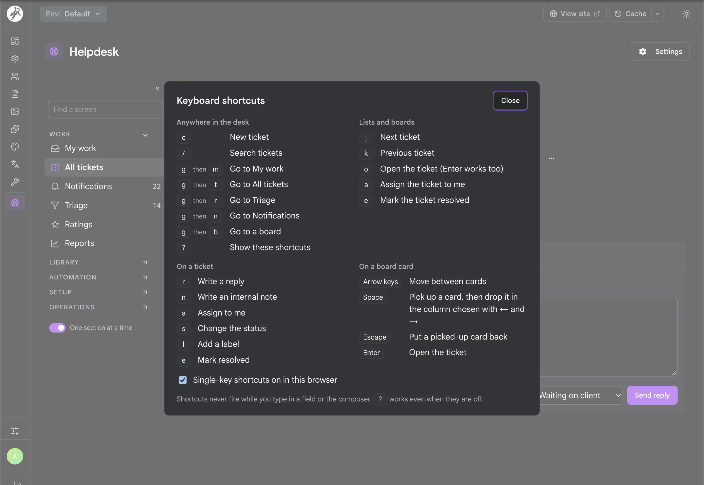 The keyboard shortcut sheet open over a ticket in the desk
