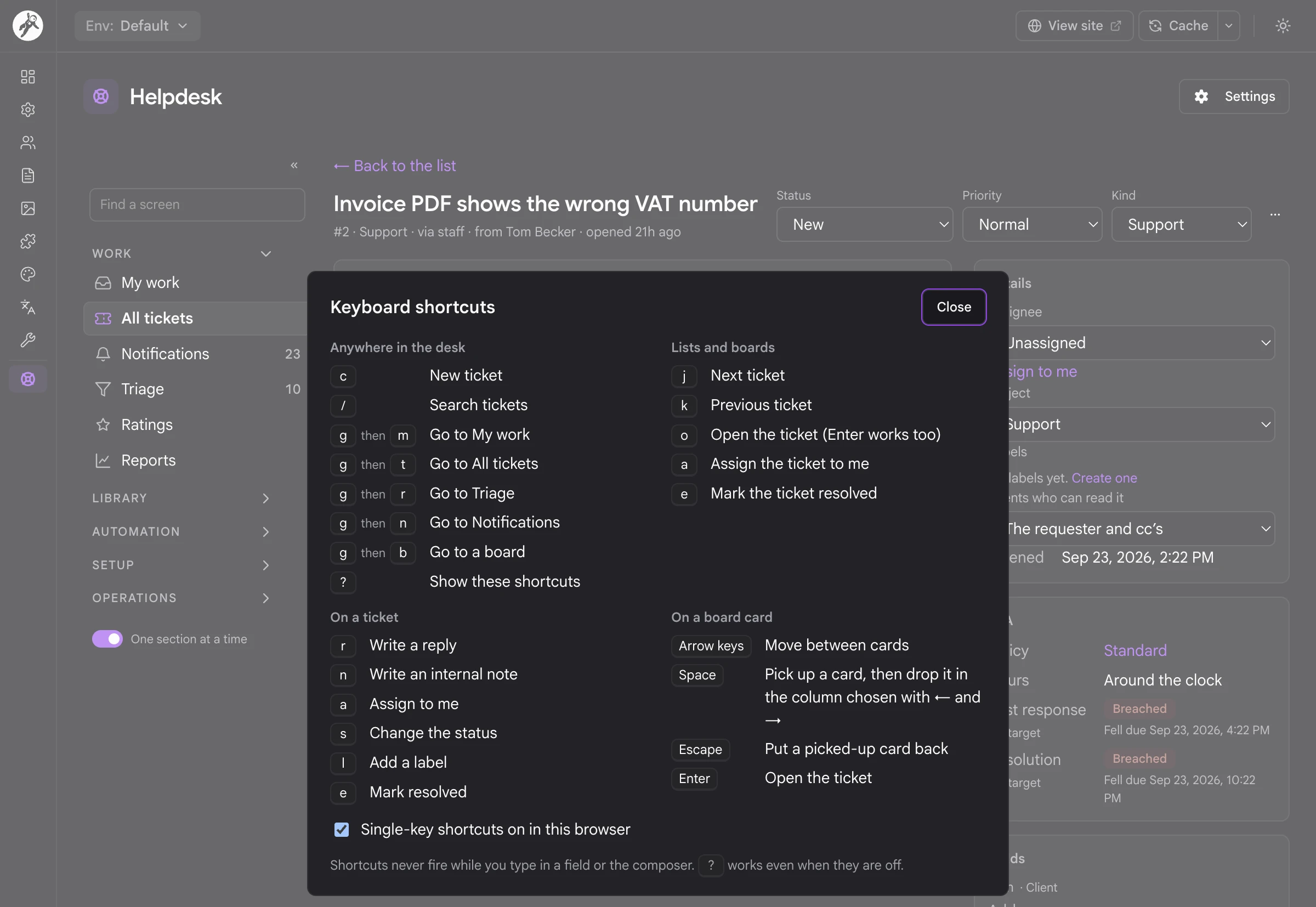 The keyboard shortcut sheet open over a ticket in the desk